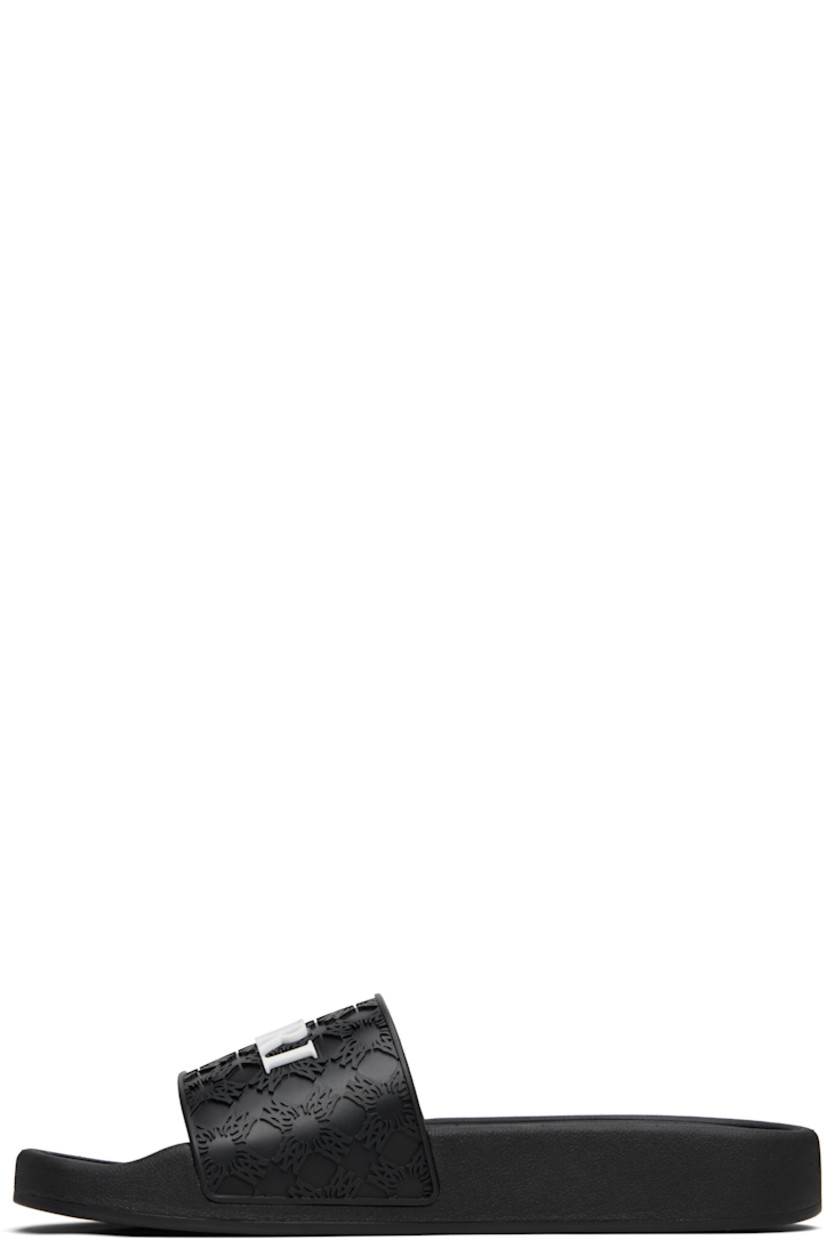 Rubber pool slides.

· Open toe
· Logo and pattern embossed at vamp
· Treaded rubber sole

Supplier color: Black
