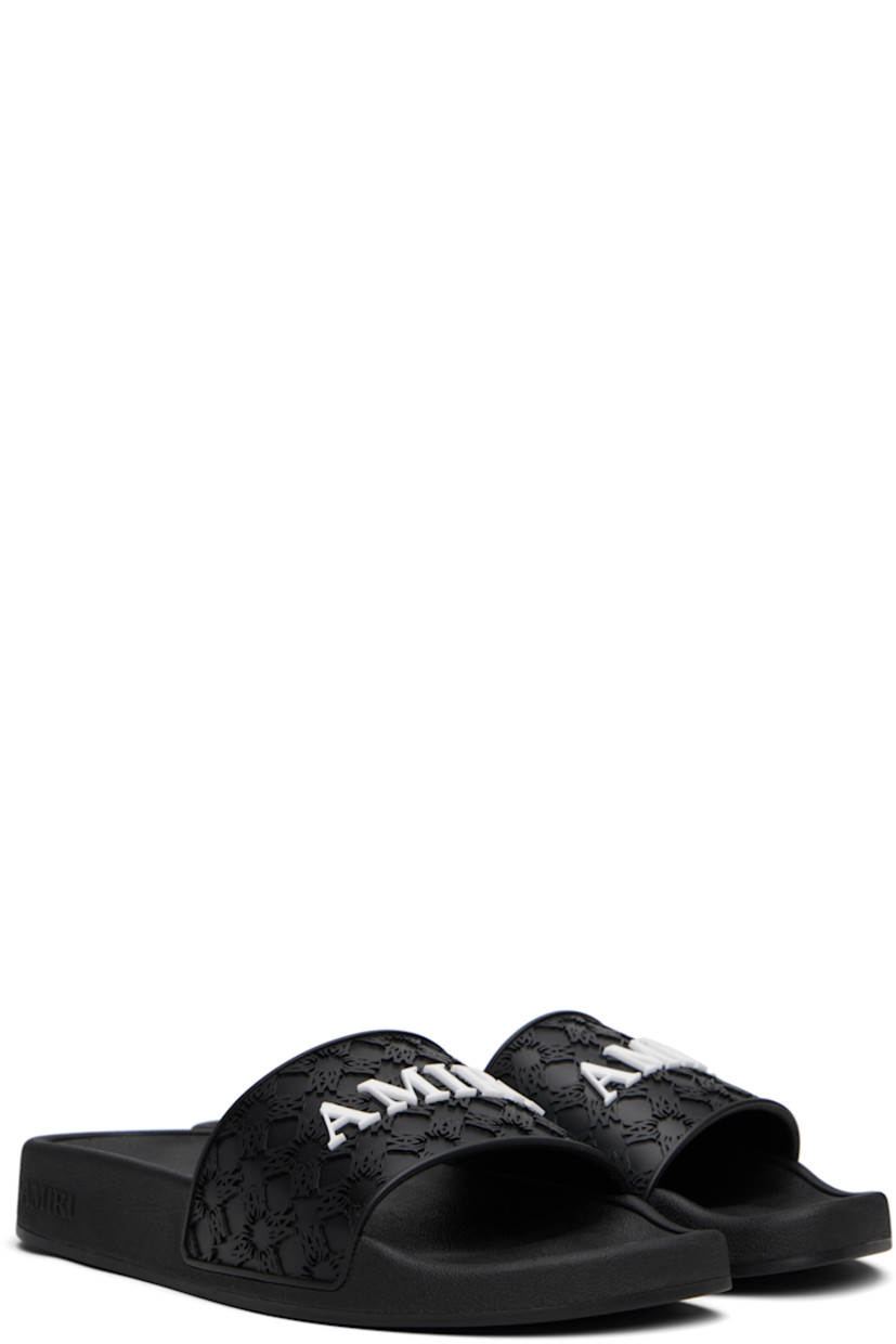 Rubber pool slides.

· Open toe
· Logo and pattern embossed at vamp
· Treaded rubber sole

Supplier color: Black