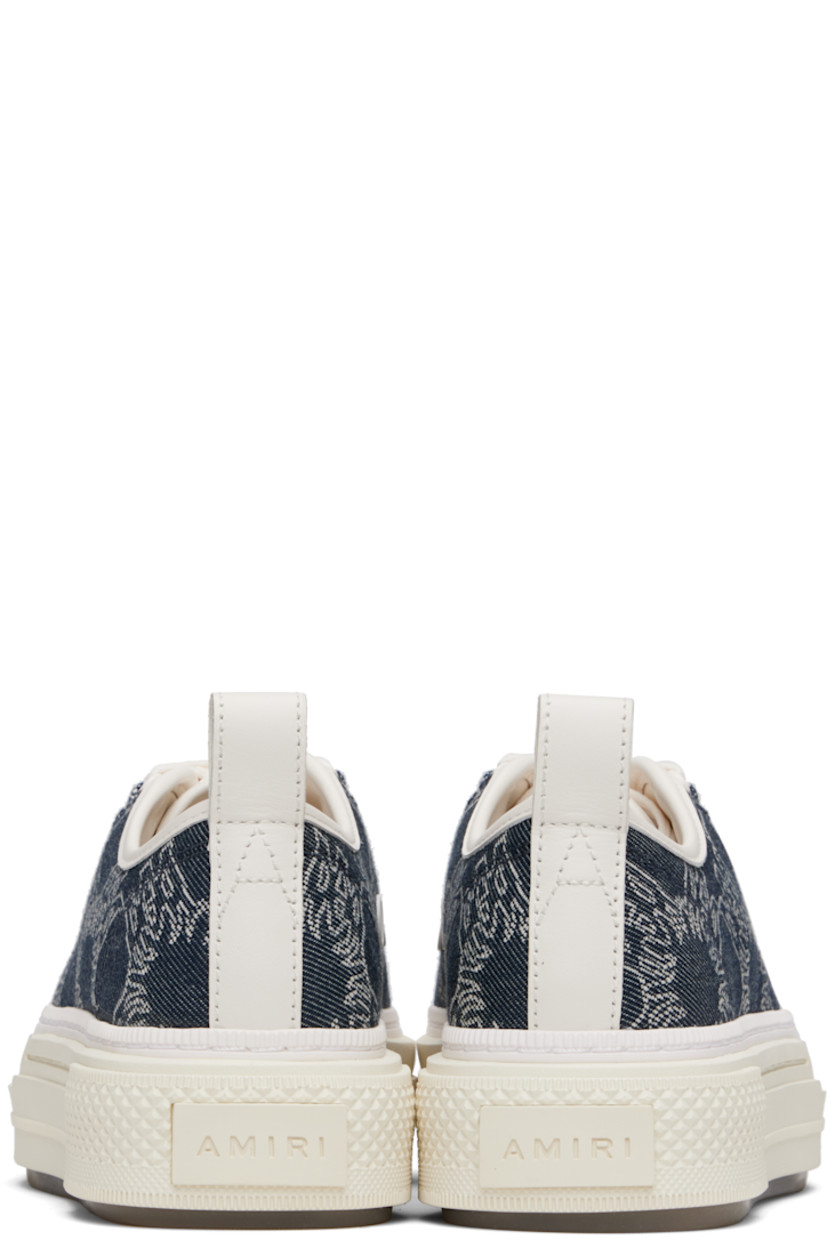 Low-top denim and buffed leather sneakers.

· Jacquard logo pattern throughout
· Rubber cap toe
· Lace-up closure
· Logo embossed at tongue
· Pull-loop at heel collar
· Vents at inner side
· Logo embossed at outer midsole
· Treaded rubber sole

Supplier color: Indigo