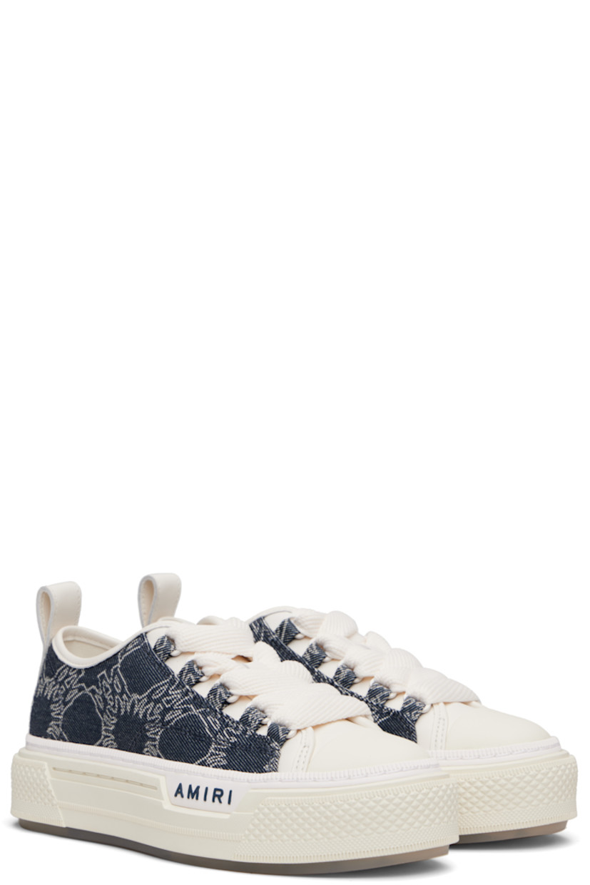 Low-top denim and buffed leather sneakers.

· Jacquard logo pattern throughout
· Rubber cap toe
· Lace-up closure
· Logo embossed at tongue
· Pull-loop at heel collar
· Vents at inner side
· Logo embossed at outer midsole
· Treaded rubber sole

Supplier color: Indigo