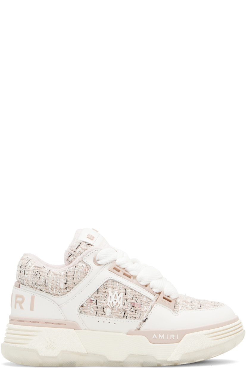 Low-top paneled grained leather and bouclé tweed sneakers. 

· Lace-up closure
· Logo patch and hardware at tongue
· Padded tongue and collar 
· Logo hardware at outer side
· Perforations at sides
· Logo embossed at heel counter
· Terrycloth lining
· Logo embossed at textured rubber midsole
· Treaded rubber sole

Supplier color: Evening sand