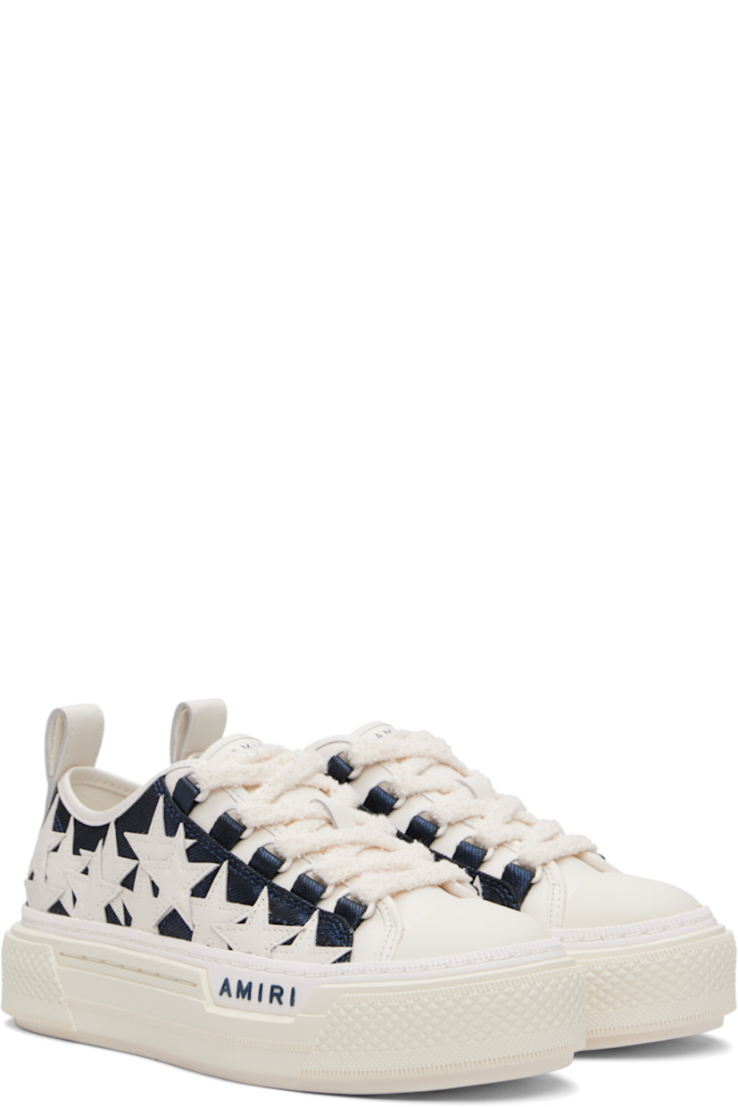 Low-top twill and buffed leather sneakers. 

· Rubber cap toe
· Lace-up closure
· Logo embossed at tongue 
· Graphic appliqués at sides
· Pull-loop at heel collar
· Mesh lining
· Logo-embossed textured rubber midsole
· Treaded rubber sole

Supplier color: Wet shimmer
