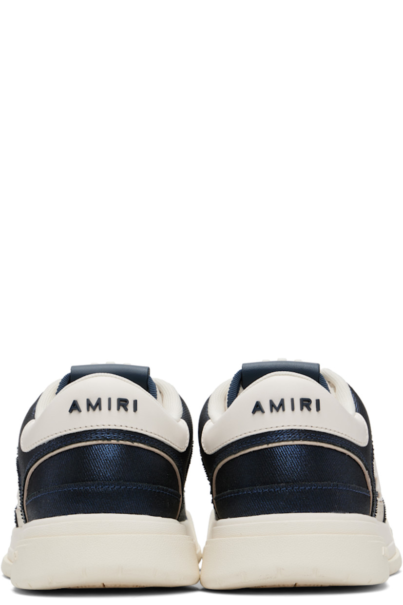 Low-top twill and buffed leather sneakers.

· Perforations at toe and sides
· Lace-up closure
· Logo patch at padded tongue
· Padded collar
· Logo appliqué at sides
· Logo embossed at heel counter and midsole
· Mesh lining
· Treaded rubber sole

Supplier color: Wet shimmer