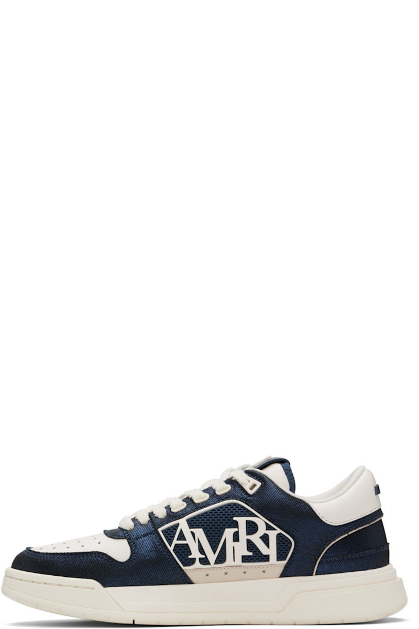 Low-top twill and buffed leather sneakers.

· Perforations at toe and sides
· Lace-up closure
· Logo patch at padded tongue
· Padded collar
· Logo appliqué at sides
· Logo embossed at heel counter and midsole
· Mesh lining
· Treaded rubber sole

Supplier color: Wet shimmer