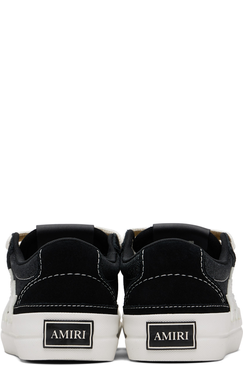 Low-top suede and glittered canvas sneakers.

· Lace-up closure
· Logo patch at padded tongue
· Padded collar
· Buffed leather graphic appliqués at outer side
· Mesh lining
· Rubberized logo patch at heel
· Textured rubber midsole
· Treaded rubber sole

Supplier color: Black