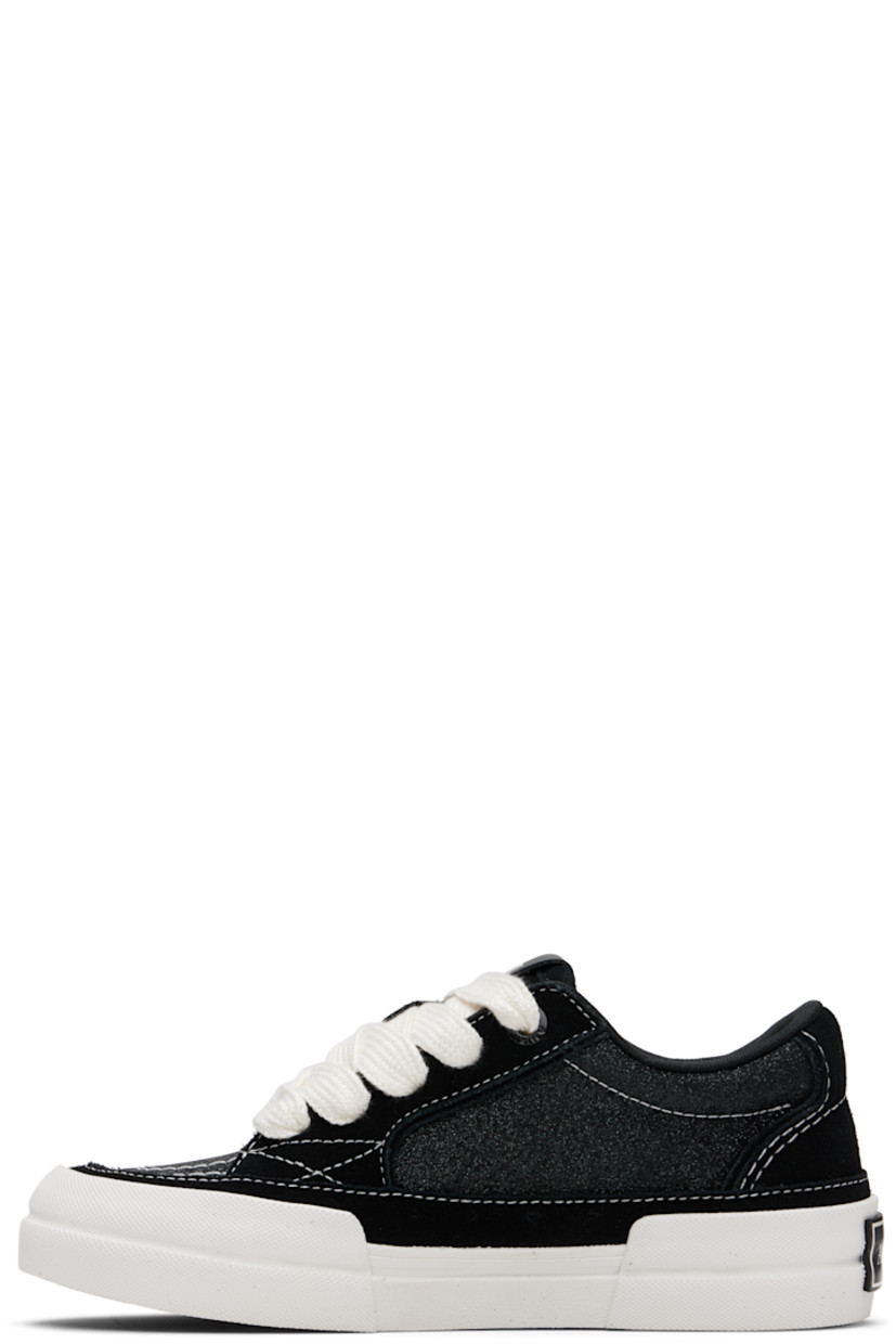 Low-top suede and glittered canvas sneakers.

· Lace-up closure
· Logo patch at padded tongue
· Padded collar
· Buffed leather graphic appliqués at outer side
· Mesh lining
· Rubberized logo patch at heel
· Textured rubber midsole
· Treaded rubber sole

Supplier color: Black
