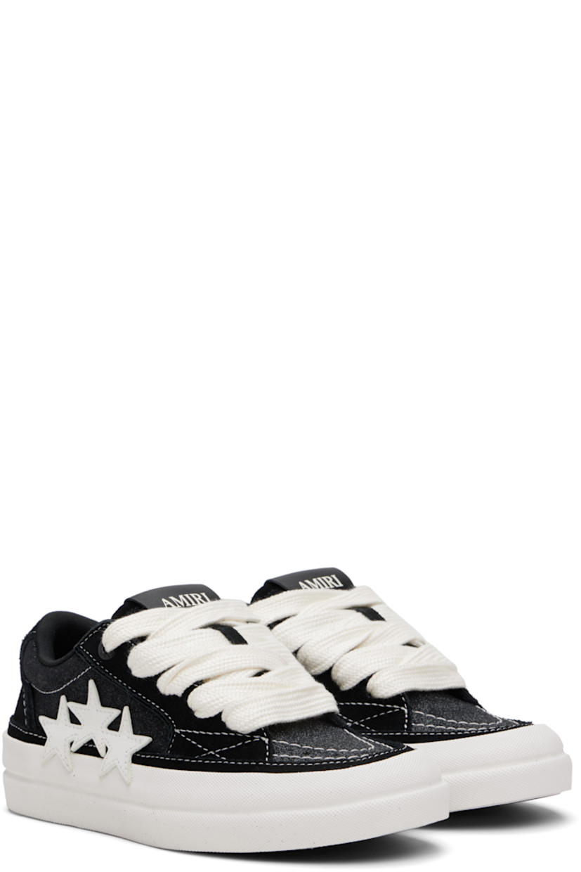 Low-top suede and glittered canvas sneakers.

· Lace-up closure
· Logo patch at padded tongue
· Padded collar
· Buffed leather graphic appliqués at outer side
· Mesh lining
· Rubberized logo patch at heel
· Textured rubber midsole
· Treaded rubber sole

Supplier color: Black