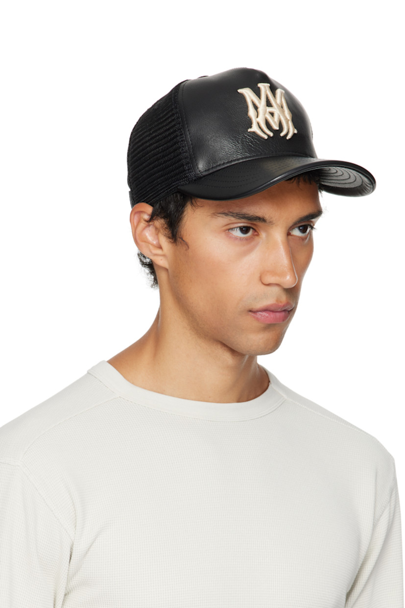 Mesh and buffed leather cap.

· Logo embroidered at face
· Curved brim
· Logo plaque at snapback fastening
· Twill lining

Supplier color: Black