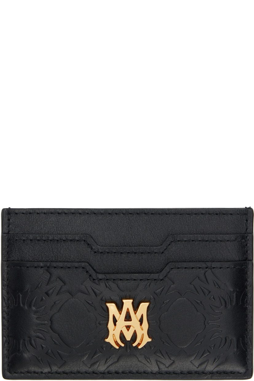 Grained and buffed leather card holder.

· Logo pattern embossed throughout
· Logo hardware at face
· Logo stamp at back face
· Four card slots
· Central note slot
· Leather lining
· H2.75" x W4"

Supplier color: Black