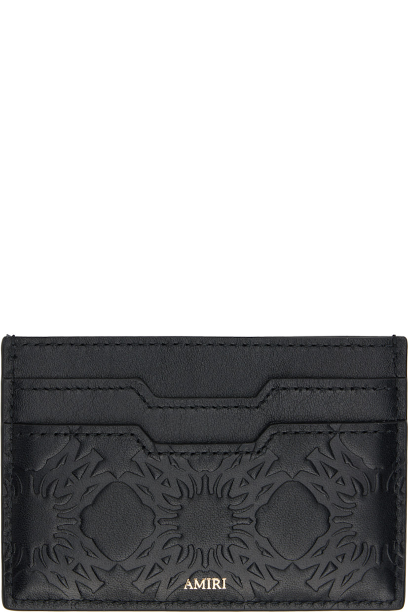 Grained and buffed leather card holder.

· Logo pattern embossed throughout
· Logo hardware at face
· Logo stamp at back face
· Four card slots
· Central note slot
· Leather lining
· H2.75" x W4"

Supplier color: Black