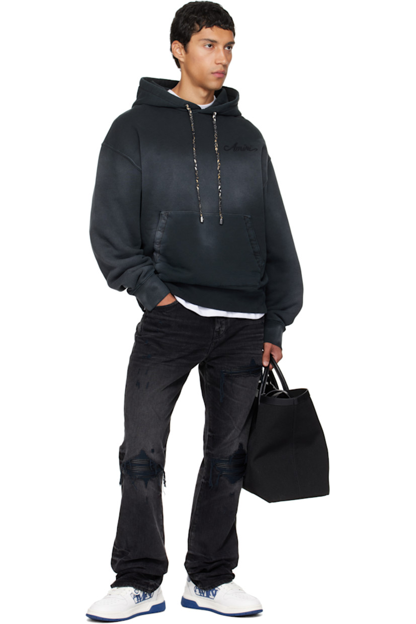 Canvas tote. 

· Buffed leather trim throughout 
· Rolled carry handles
· Fixed shoulder straps 
· Logo stamp at face 
· Embroidered text and logo at face
· Logo-engraved lanyard-clasp closure 
· Zip pocket at interior 
· Full logo-woven satin lining 
· H13" x W21" x D7"

Supplier color: Black