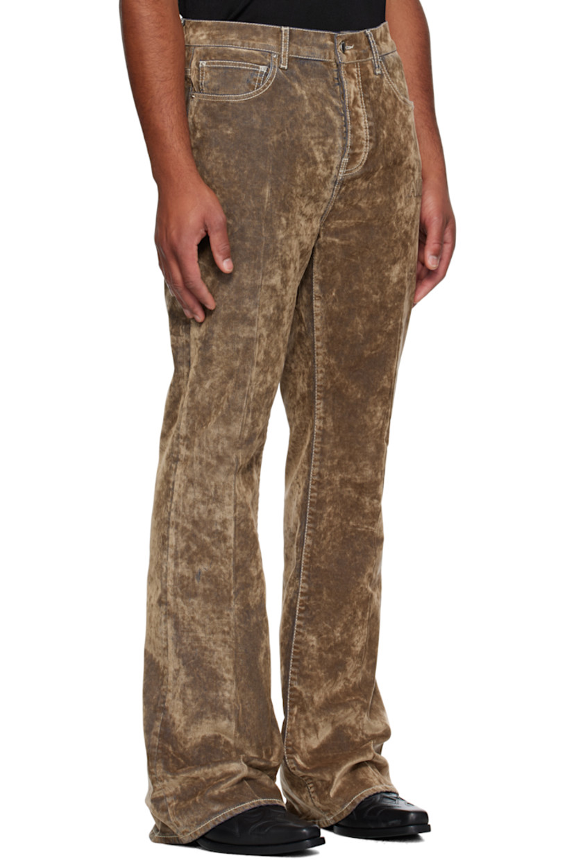 Stretch velvet jeans.

· Flared-leg
· Belt loops
· Five-pocket styling
· Button fly 
· Logo patch at back waistband
· Contrast stitching in white

Supplier color: Tan