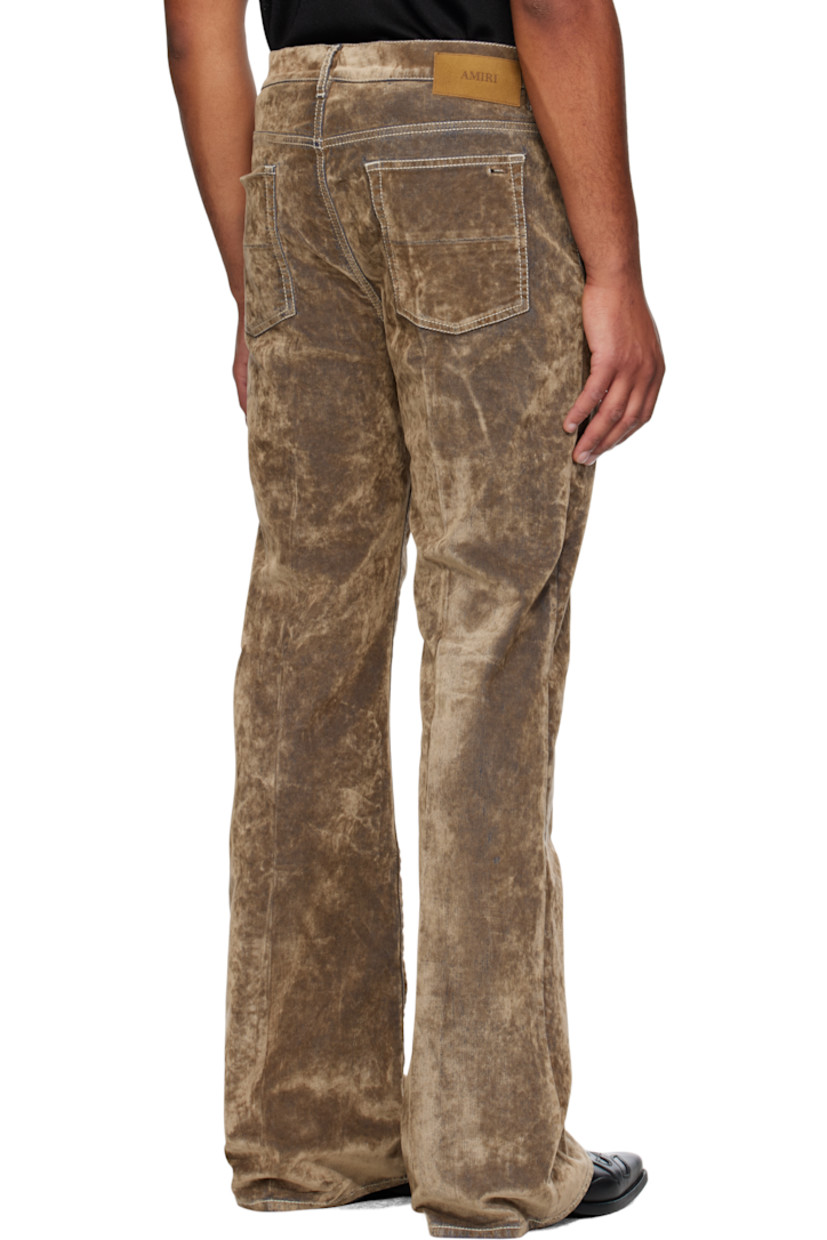 Stretch velvet jeans.

· Flared-leg
· Belt loops
· Five-pocket styling
· Button fly 
· Logo patch at back waistband
· Contrast stitching in white

Supplier color: Tan