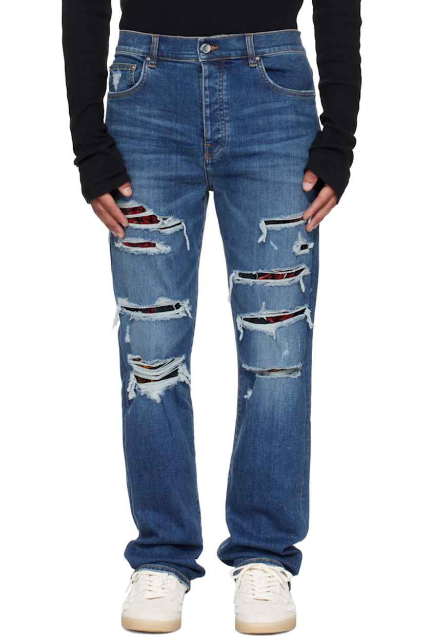 Stretch denim jeans. 

· Fading, distressing, and whiskering throughout 
· Belt loops
· Five-pocket styling
· Button fly 
· Floral-printed velvet panel at legs and back
· Leather logo patch at back waistband
· Logo plaque at back pocket 
· Contrast stitching in tan 

Supplier color: Dark indigo