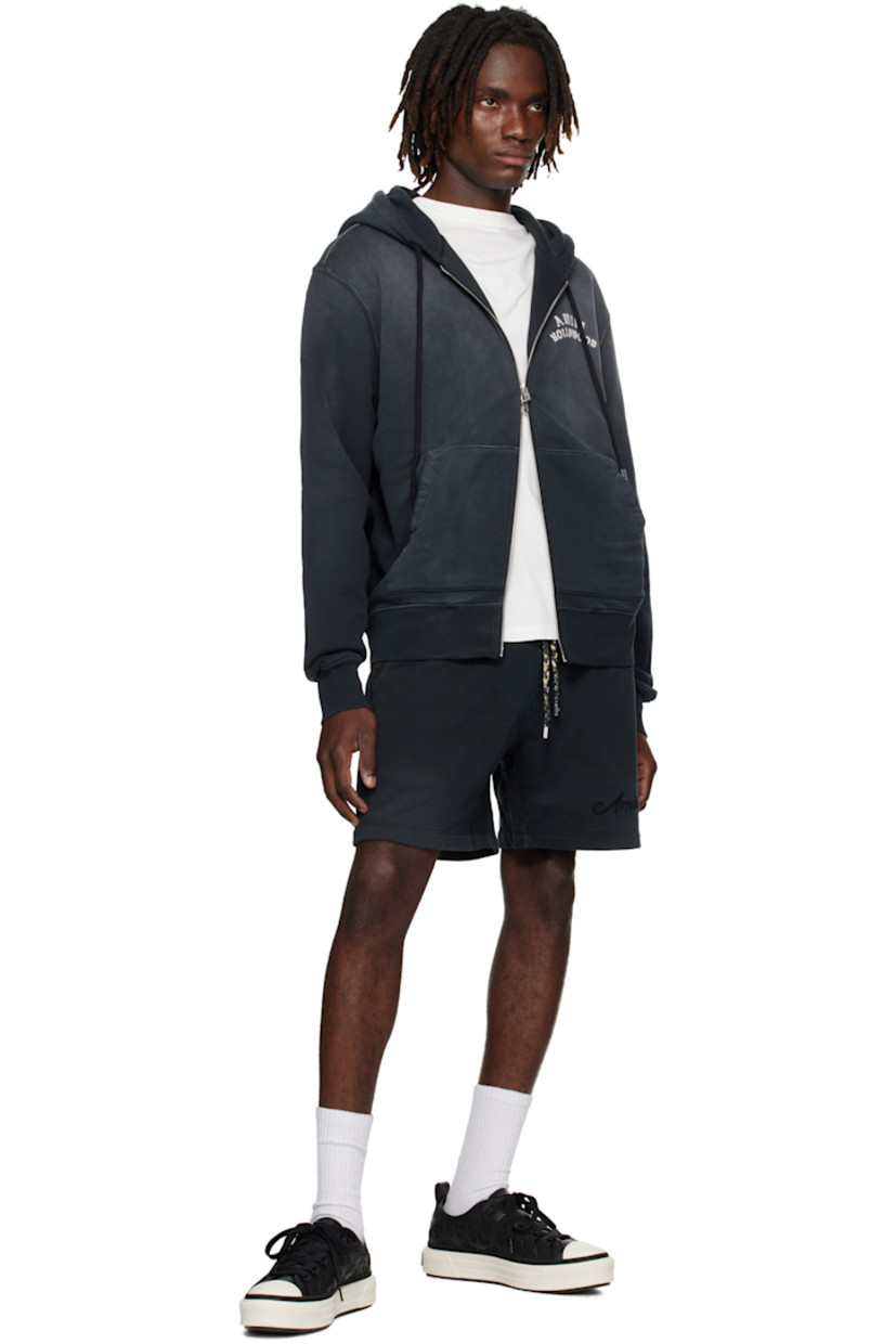 Cotton French terry hoodie.

· Fading throughout
· Drawstring at hood
· Two-way zip closure
· Logo and text printed at chest and back
· Patch pockets at front
· Rib-knit hem and cuffs
· Dropped shoulders

Supplier color: Black