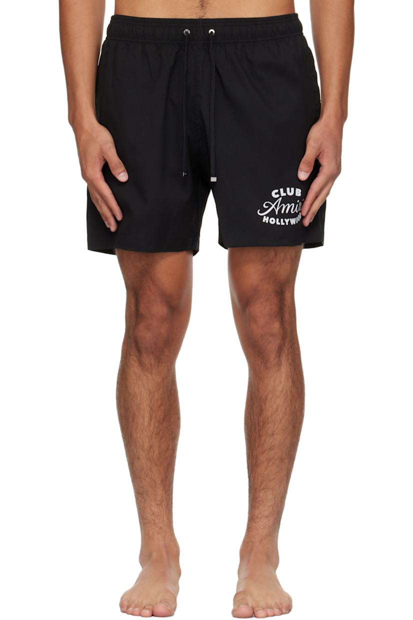 Taffeta swim shorts. 

· Drawstring at elasticized waistband
· Three-pocket styling
· Logo and text printed at front 
· Rubber logo patch at back waistband
· Grommet at back pocket 
· Full mesh brief-style lining

Supplier color: Black