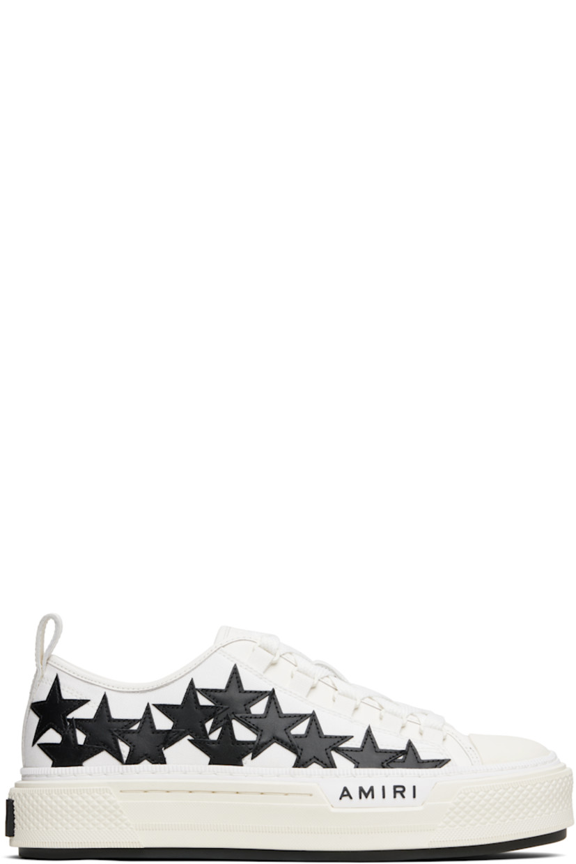 Low-top canvas and buffed leather sneakers.

· Buffed leather trim throughout
· Rubber cap toe
· Lace-up closure
· Logo patch at padded tongue
· Padded collar
· Graphic appliqués at sides
· Logo embossed at outer side
· Pull-loop at heel collar
· Logo embroidered at heel tab
· Buffed leather lining
· Treaded rubber sole

Supplier color: White/Black