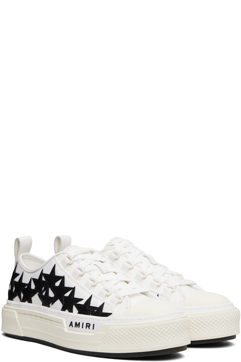Low-top canvas and buffed leather sneakers.

· Buffed leather trim throughout
· Rubber cap toe
· Lace-up closure
· Logo patch at padded tongue
· Padded collar
· Graphic appliqués at sides
· Logo embossed at outer side
· Pull-loop at heel collar
· Logo embroidered at heel tab
· Buffed leather lining
· Treaded rubber sole

Supplier color: White/Black