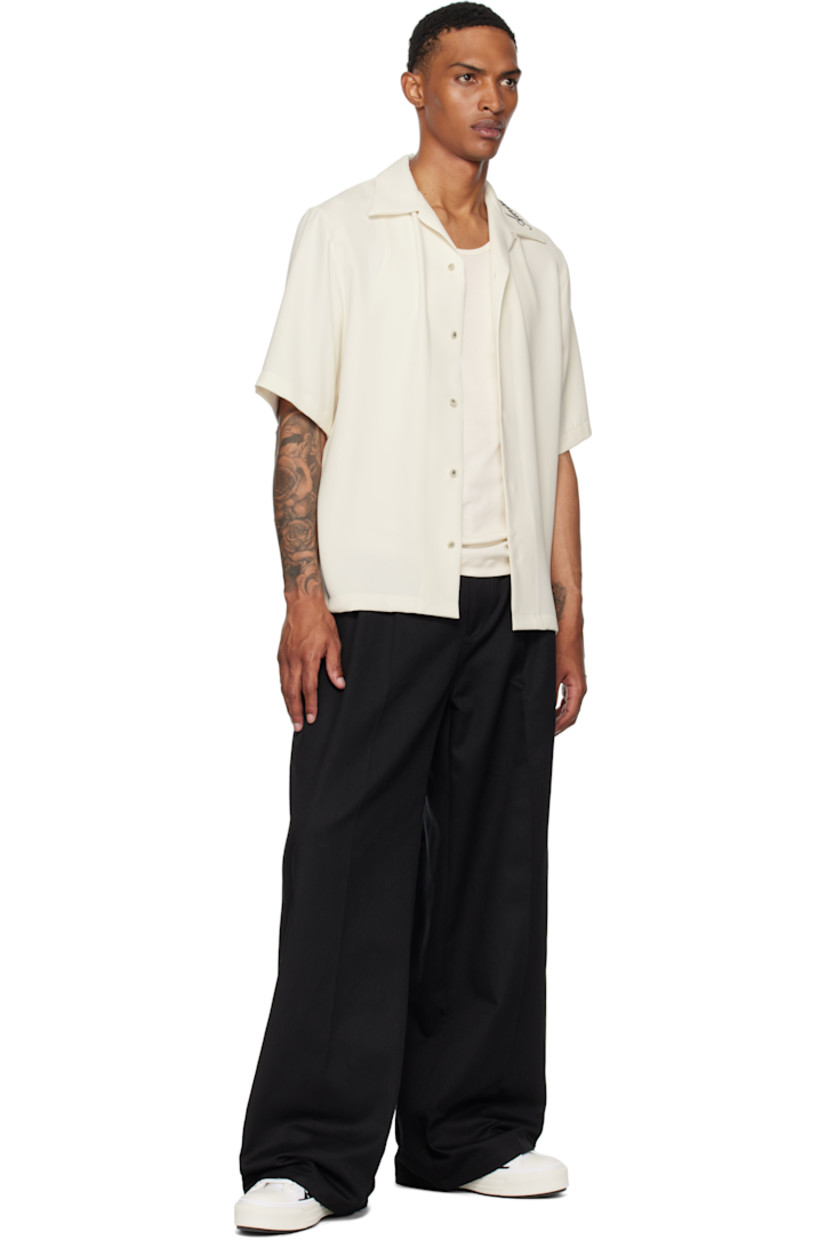 Low-top canvas and buffed leather sneakers.

· Buffed leather trim throughout
· Rubber cap toe
· Lace-up closure
· Logo patch at padded tongue
· Padded collar
· Graphic appliqués at sides
· Logo embossed at outer side
· Pull-loop at heel collar
· Logo embroidered at heel tab
· Buffed leather lining
· Treaded rubber sole

Supplier color: White/Black