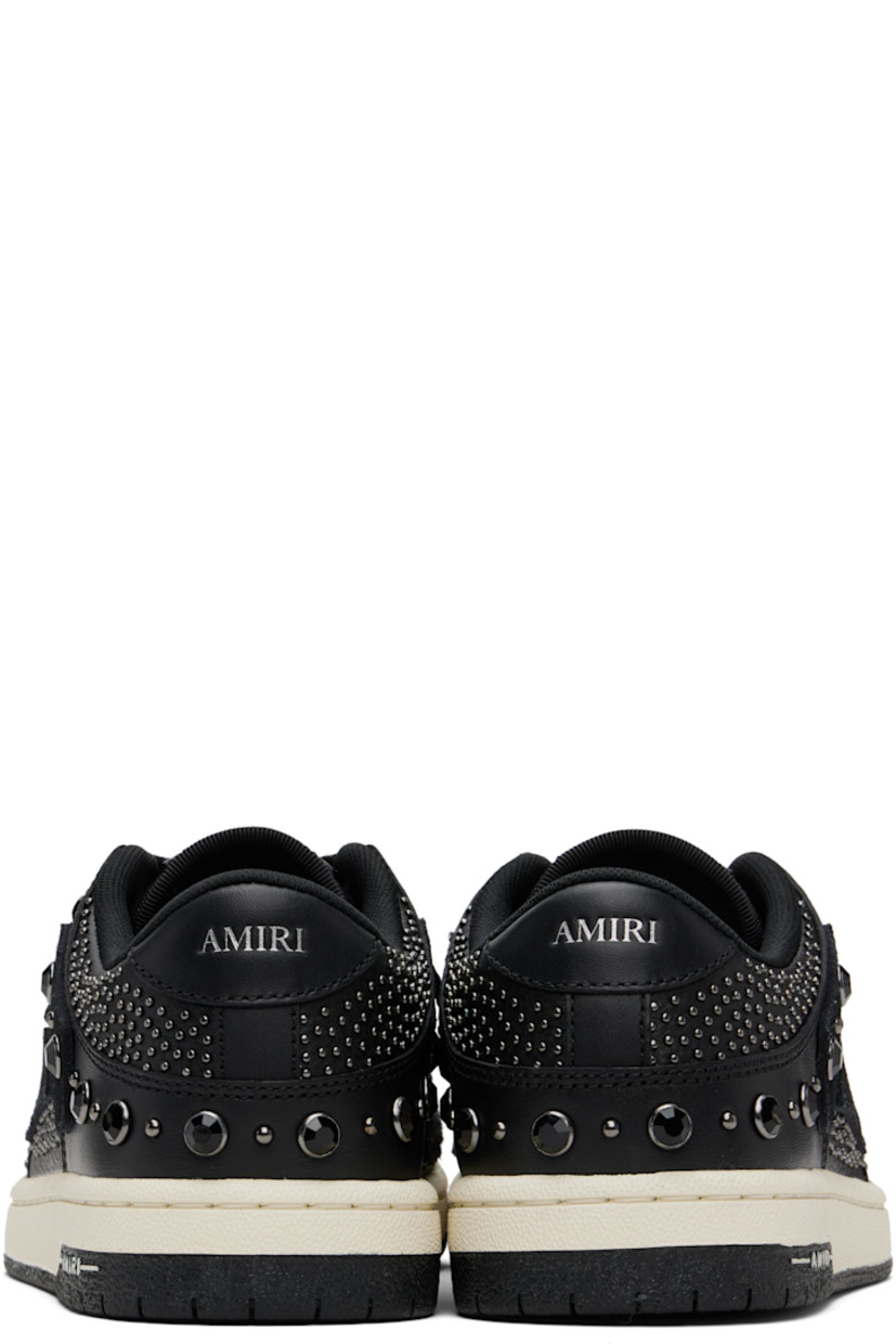 Low-top grained leather sneakers.

· Studs and crystal-cut accents throughout
· Perforations at toe
· Lace-up closure
· Logo embossed at tongue and heel tab
· Padded tongue and collar
· Graphic appliqués at sides
· Mesh lining
· Logo embossed at textured rubber midsole
· Treaded rubber sole

Supplier color: Black