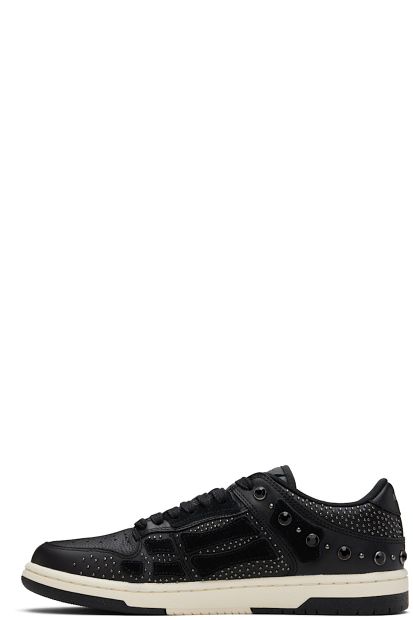 Low-top grained leather sneakers.

· Studs and crystal-cut accents throughout
· Perforations at toe
· Lace-up closure
· Logo embossed at tongue and heel tab
· Padded tongue and collar
· Graphic appliqués at sides
· Mesh lining
· Logo embossed at textured rubber midsole
· Treaded rubber sole

Supplier color: Black
