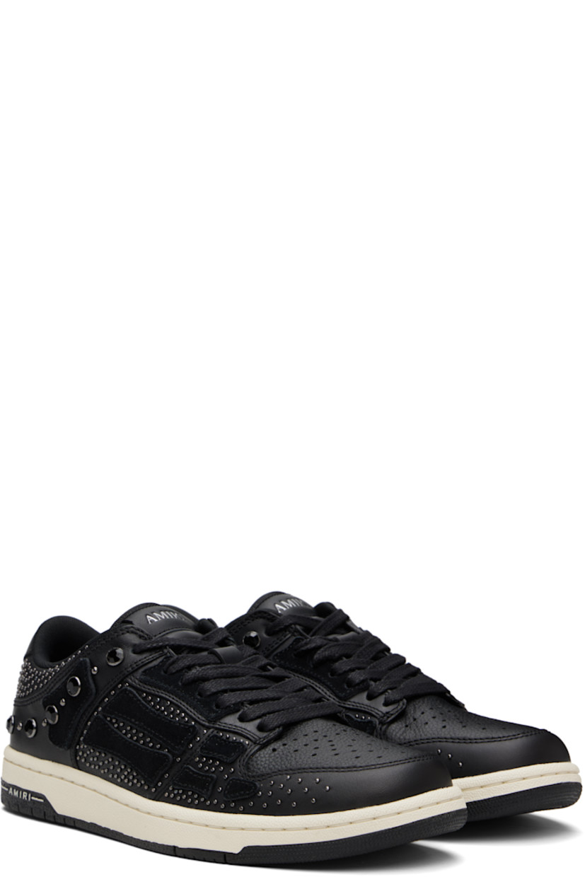 Low-top grained leather sneakers.

· Studs and crystal-cut accents throughout
· Perforations at toe
· Lace-up closure
· Logo embossed at tongue and heel tab
· Padded tongue and collar
· Graphic appliqués at sides
· Mesh lining
· Logo embossed at textured rubber midsole
· Treaded rubber sole

Supplier color: Black