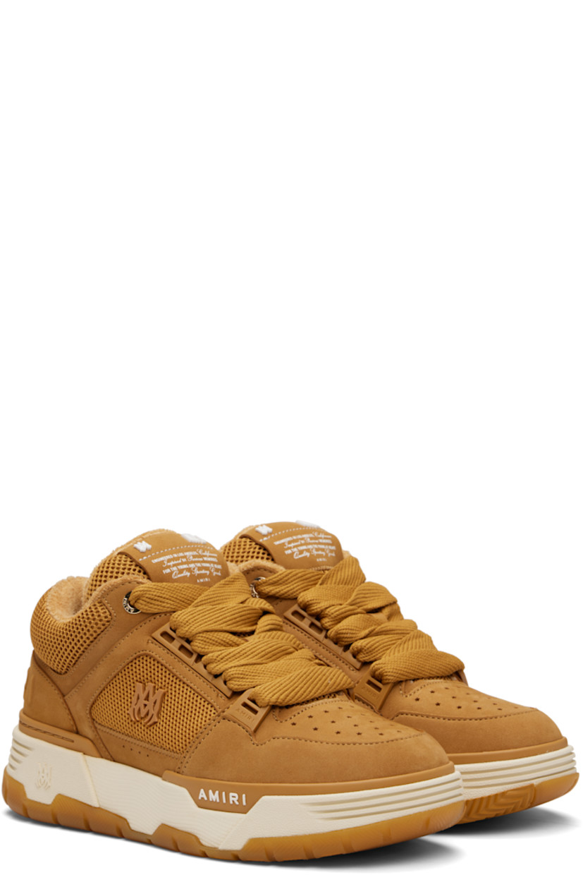 Low-top mesh and nubuck sneakers.

· Perforations at toe
· Lace-up closure
· Logo patch at padded tongue
· Padded collar
· Logo appliqué at outer side
· Logo embossed at heel counter and midsole
· Terrycloth lining
· Treaded rubber sole

Supplier color: Wheat