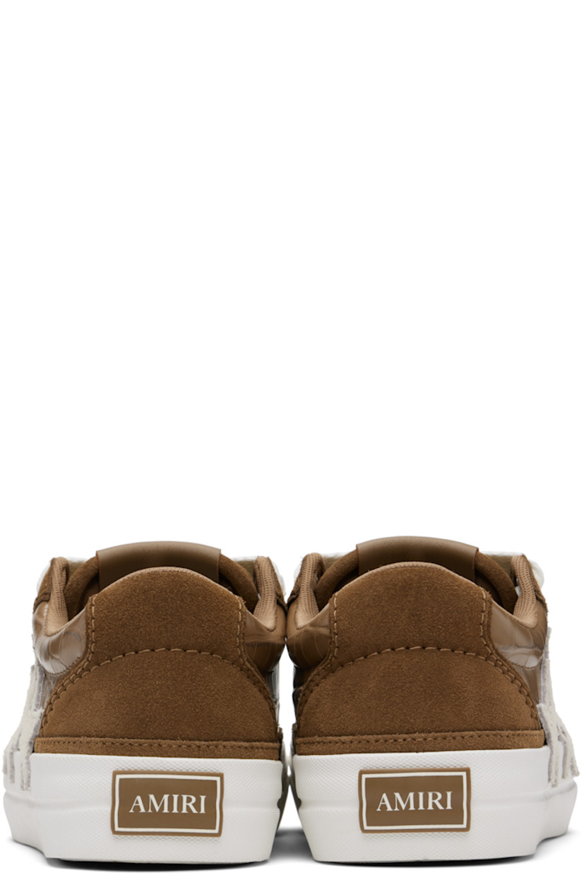 Low-top suede and croc-embossed leather sneakers.

· Lace-up closure
· Logo patch at padded tongue
· Padded collar
· Graphic appliqués at outer side
· Mesh lining
· Rubberized logo patch at heel
· Textured rubber midsole
· Treaded rubber sole

Supplier color: Dark brown
