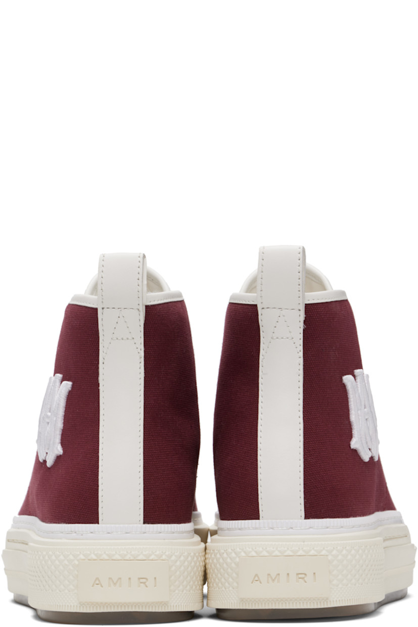 High-top canvas and buffed leather sneakers.

· Rubber cap toe
· Lace-up closure
· Logo patch at padded tongue
· Padded collar
· Logo embroidered and embossed at outer side
· Metal eyelets at inner side
· Pull-loop at heel collar
· Buffed leather lining
· Rubberized logo patch at heel
· Logo embossed at textured rubber midsole
· Treaded rubber sole

Supplier color: Wine