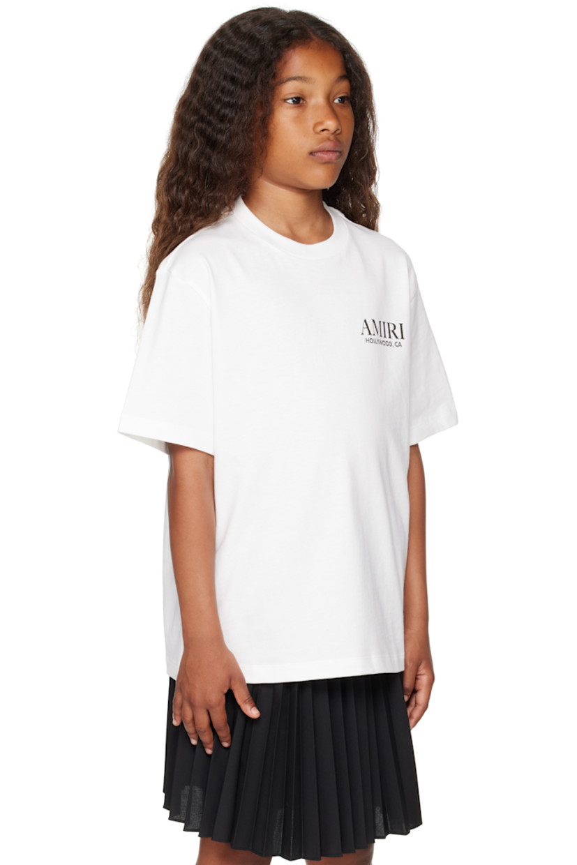 Cotton jersey T-shirt. 

· Rib-knit crewneck
· Logo and text printed at chest
· Graphic, logo, and text printed at back 
· Machine-wash

Supplier color: Ivory 

Model measures 51.97" / 132 cm tall and wears size 8Y.

Size: child's height
4Y: 41.25" / 105 cm 
6Y: 46.75" / 118.5 cm 
8Y: 52.25" / 132.5 cm 
10Y: 55.25" / 140.5 cm 
12Y: 58.5" / 148.5 cm