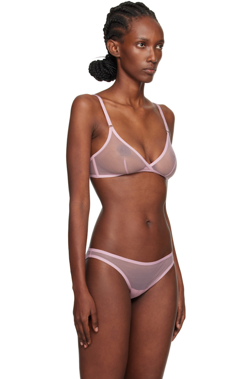 Sheer stretch nylon-blend tulle bra.

· Elasticized hem
· Dart at cups
· Boning at sides
· Adjustable elasticized shoulder straps
· Adjustable hook-eye fastening at back

Supplier color: Mauve