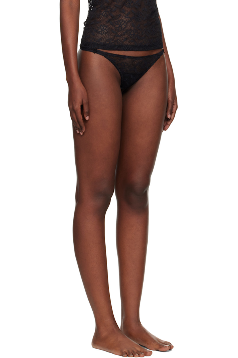 Semi-sheer stretch nylon-blend lace thong.

· Picot trim and floral pattern throughout
· Straps and foral appliqué at sides
· Partial jersey lining

Supplier color: Black