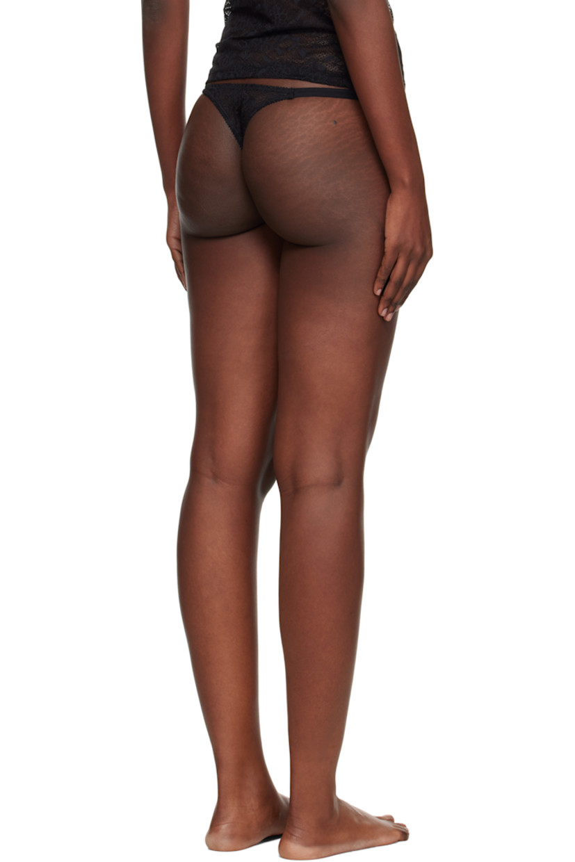 Semi-sheer stretch nylon-blend lace thong.

· Picot trim and floral pattern throughout
· Straps and foral appliqué at sides
· Partial jersey lining

Supplier color: Black