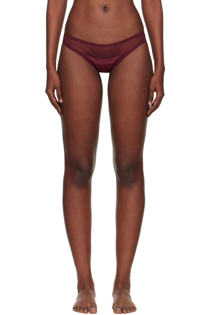 Semi-sheer stretch nylon-blend tulle thong.

· Low-rise
· Elasticized waistband
· Partial jersey lining

Supplier color: Burgundy