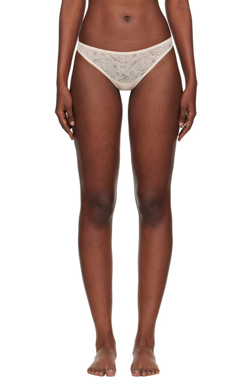 Semi-sheer stretch nylon-blend lace thong. 

· Picot trim and floral pattern throughout
· Elasticized waistband
· Partial jersey lining

Supplier color: Sand