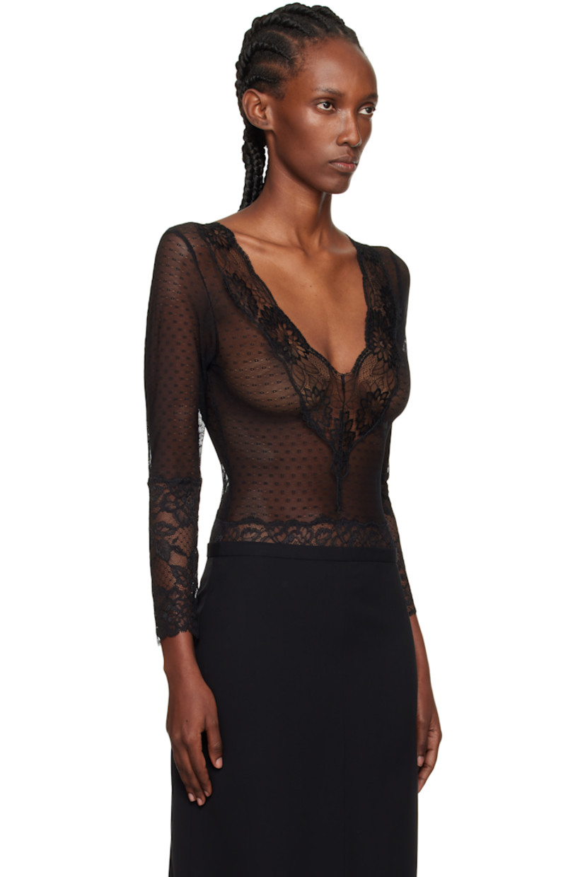 Semi-sheer stretch nylon-blend lace bodysuit.

· Floral pattern throughout
· Scalloped edge at V-neck and cuffs
· Adjustable hook-eye fastening at bottom
· Picot trim at leg openings
· Low back
· Partial jersey lining

Supplier color: Black