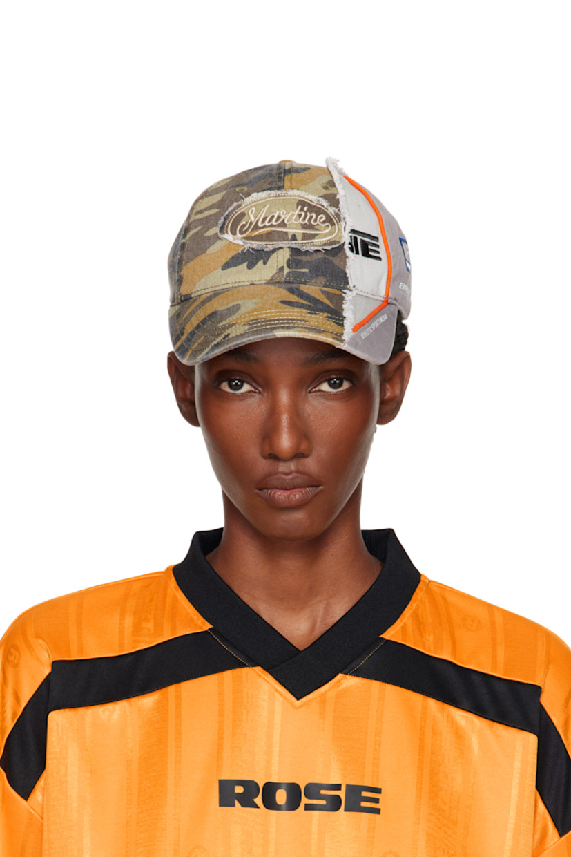 Paneled cotton twill cap.

· Camouflage pattern throughout
· Curved brim
· Embroidered logos and raw edges
· Embroidered eyelets at crown
· Velcro strap

Supplier color: Green Camo