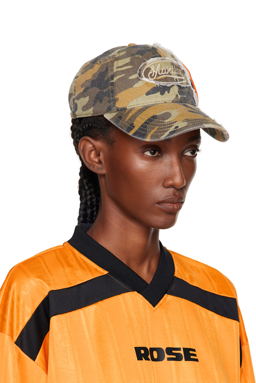 Paneled cotton twill cap.

· Camouflage pattern throughout
· Curved brim
· Embroidered logos and raw edges
· Embroidered eyelets at crown
· Velcro strap

Supplier color: Green Camo
