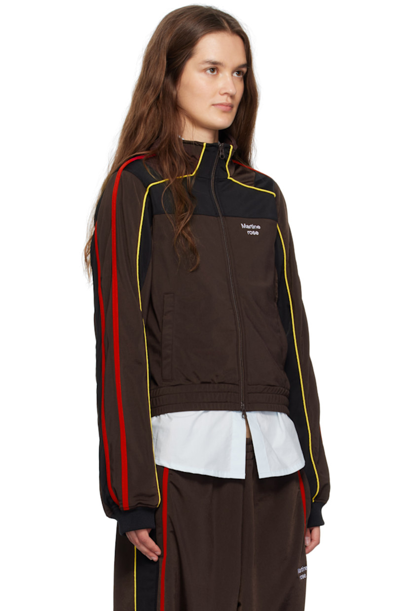 Fleece track jacket.

· Stand collar
· Two-way zip closure
· Stripe appliqués and piping at front and sleeves
· Logo embroidered at chest
· Zip pockets at front
· Elasticized hem

Supplier color: Brown/Black