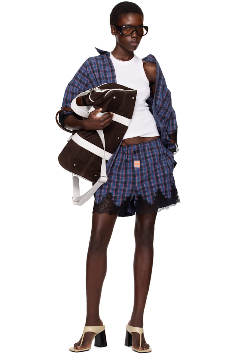 Cotton seersucker shorts. Check pattern and scalloped edges throughout. 

· Bow appliqué at elasticized waistband 
· Logo patch at button fly 
· Two-pocket styling
· Lace trim at cuffs

Part of the exclusive SSENSE HEAT capsule.

Supplier color: Blue navy check
