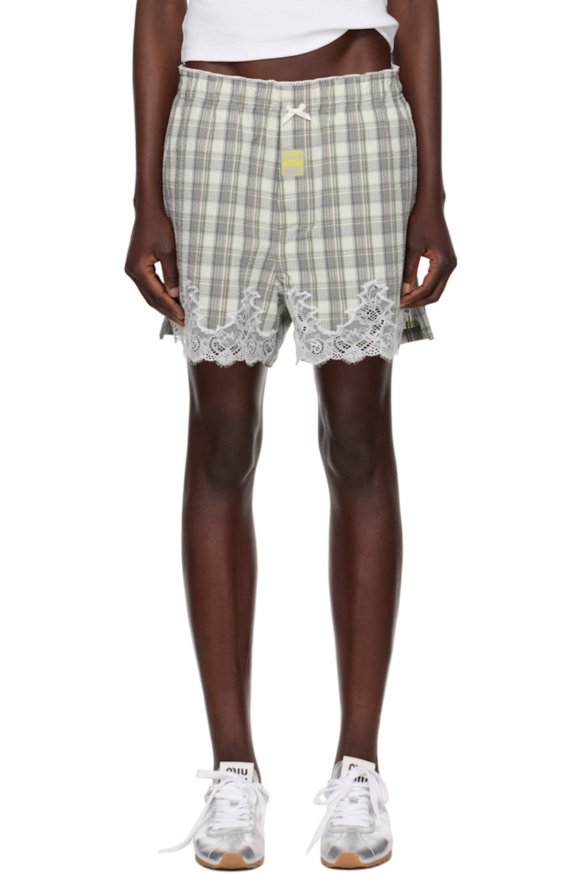 Cotton seersucker shorts. Check pattern and scalloped edges throughout. 

· Bow appliqué at elasticized waistband 
· Logo patch at button fly 
· Two-pocket styling
· Lace trim at cuffs

Part of the exclusive SSENSE HEAT capsule.

Supplier color: Grey lime check