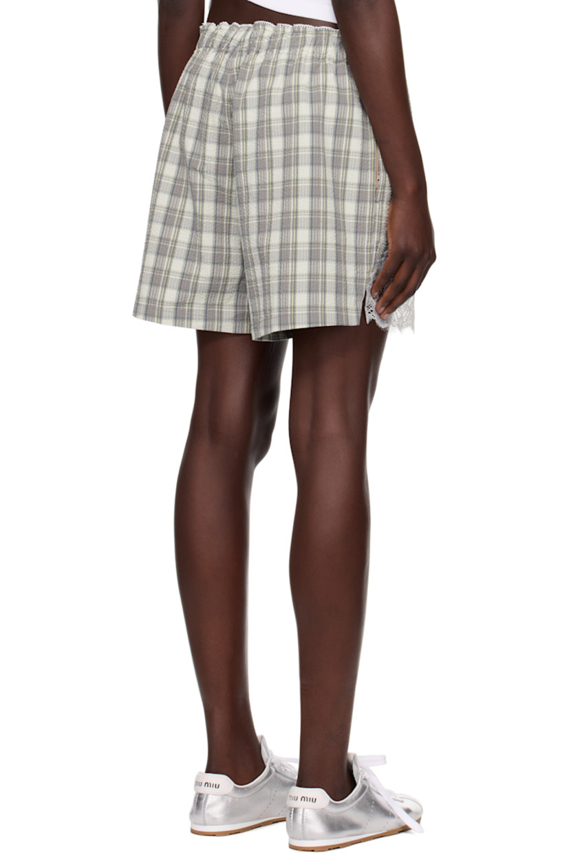 Cotton seersucker shorts. Check pattern and scalloped edges throughout. 

· Bow appliqué at elasticized waistband 
· Logo patch at button fly 
· Two-pocket styling
· Lace trim at cuffs

Part of the exclusive SSENSE HEAT capsule.

Supplier color: Grey lime check
