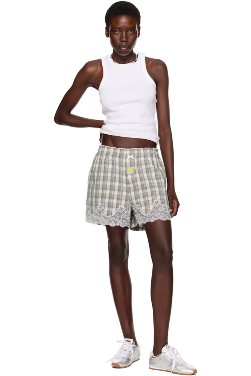 Cotton seersucker shorts. Check pattern and scalloped edges throughout. 

· Bow appliqué at elasticized waistband 
· Logo patch at button fly 
· Two-pocket styling
· Lace trim at cuffs

Part of the exclusive SSENSE HEAT capsule.

Supplier color: Grey lime check