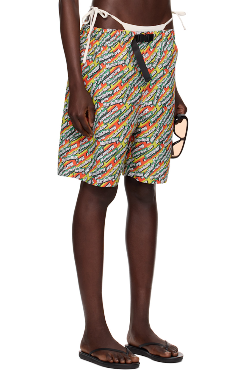 Polyester taffeta swim shorts. Logo pattern printed throughout. 

· Integrated press-release belt at elasticized waistband
· Three-pocket styling
· Mesh pocket lining

Part of the exclusive SSENSE HEAT capsule.

Supplier color: Green/Orange