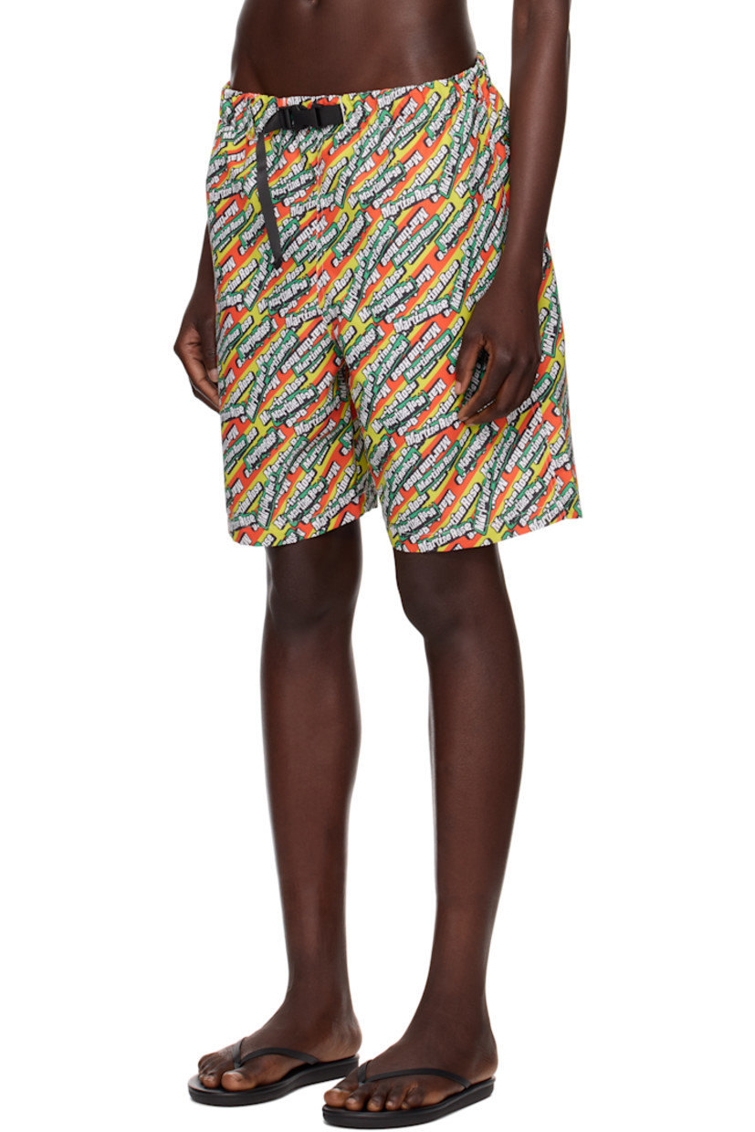 Polyester taffeta swim shorts. Logo pattern printed throughout. 

· Integrated press-release belt at elasticized waistband
· Three-pocket styling
· Mesh pocket lining

Part of the exclusive SSENSE HEAT capsule.

Supplier color: Green/Orange