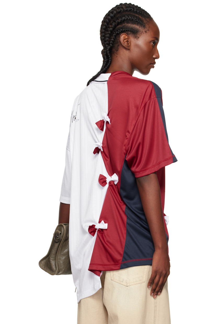 Mesh top.

· Paneled construction
· Asymmetrical collar and hem
· Press-stud placket
· Logo patch and flocked logo at chest
· Gathering and bow accents at front and back
· Logo printed at back

Supplier color: White/Burgundy