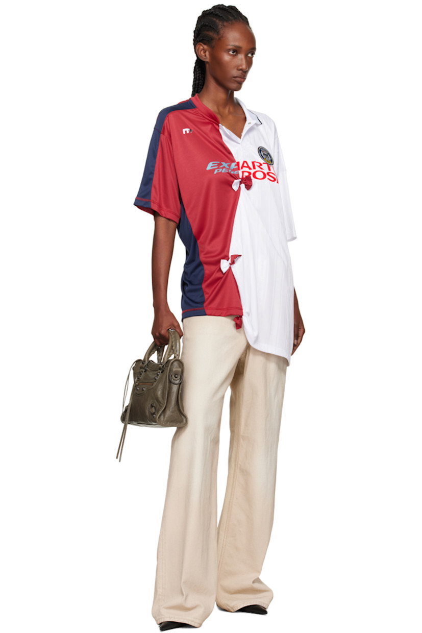 Mesh top.

· Paneled construction
· Asymmetrical collar and hem
· Press-stud placket
· Logo patch and flocked logo at chest
· Gathering and bow accents at front and back
· Logo printed at back

Supplier color: White/Burgundy