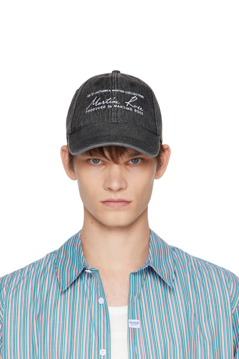 Cotton twill cap.

· Fading throughout
· Embroidered eyelets at crown
· Text embroidered at face
· Logo embroidered at face and back face
· Curved brim
· Velcro fastening
· Poplin lining

Supplier color: Black/Washed black