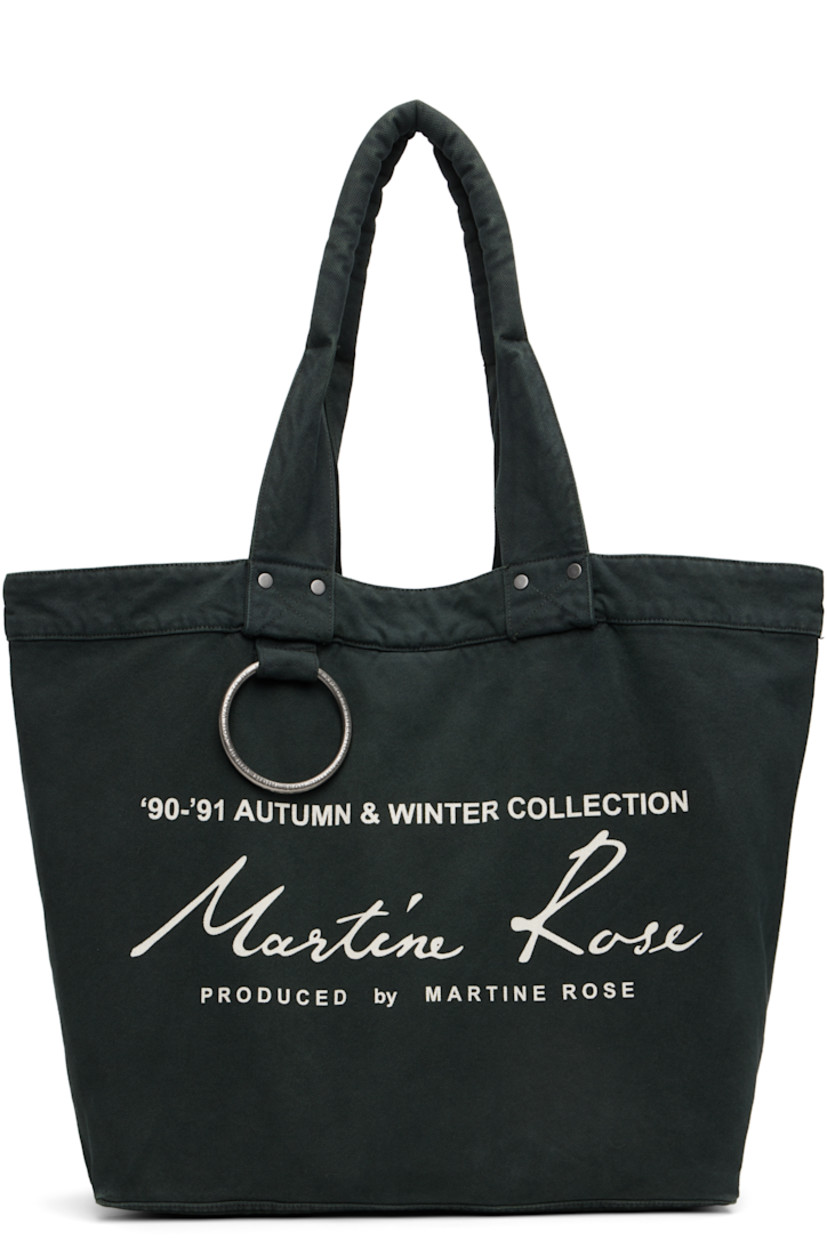 Canvas tote.

· Padded shoulder straps
· Logo-engraved O-ring and printed logo at face
· Clasp fastening at throat
· Zip pocket at interior
· H13.5" x W20" x D7"

Supplier color: Green/Dark green