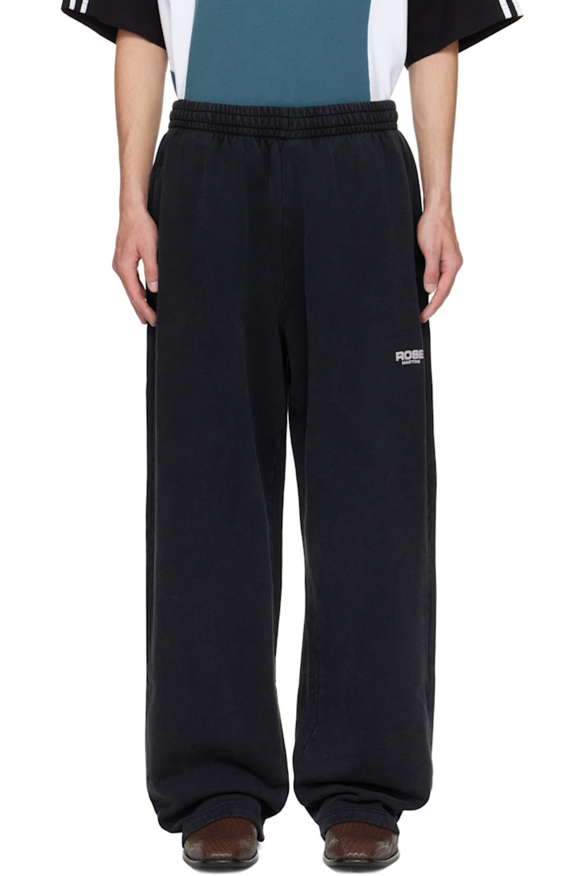 Wide-leg cotton fleece sweatpants.

· Fading throughout
· Concealed drawstring at elasticized waistband
· Two-pocket styling
· Logo printed at front

Supplier color: Black Washed